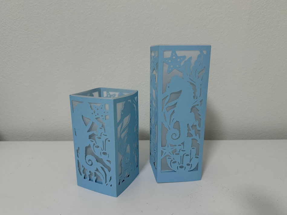 Blue luminary lantern seahorse coastal scene lighted